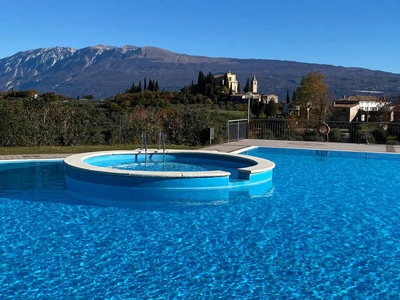 Appartamento 'Casa Vacanze Gianpietro Rossi' con vista sul lago, piscina in comune e Wi-Fi