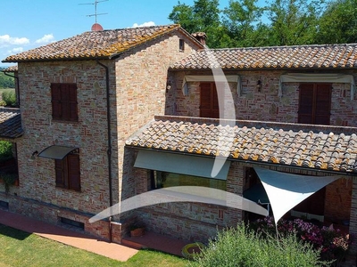 Montepulciano: Charming farmhouse for sale with panoramic views and garden, perfect for residence or hospitality business