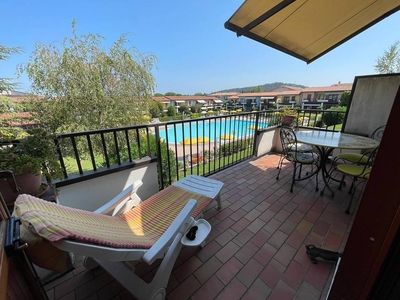Appartamento 'Appartamento Santa Giulia' con piscina condivisa, terrazza privata e aria condizionata