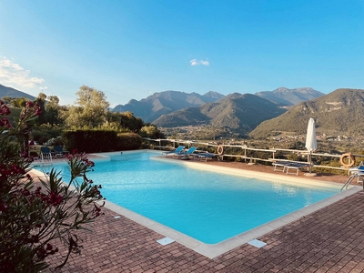 Appartamento 'Residence Le Parti' con vista sulle montagne, piscina in comune e Wi-Fi