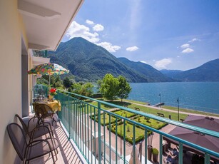 Studio sul lago con parcheggio e aria condizionata, a 100 m dal Lago di Lugano