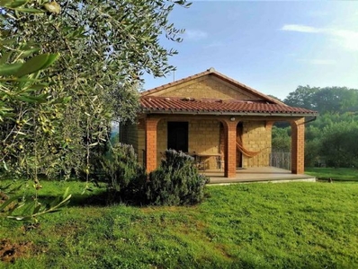 Charming Tuscan-style Stone House with Garden and Land for Sale in Parrano, Umbria - Relaxation and Well-being in the Countryside